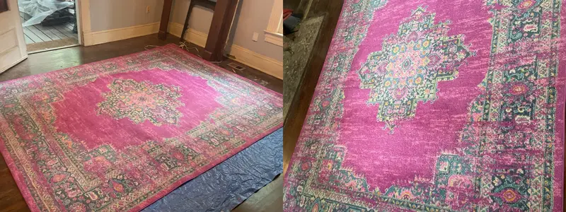 Pink and teal patterned area rug, dull in the wide shot, brighter close up