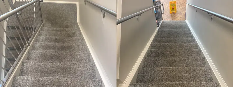 Commercial stairwell carpet with dark traffic lanes on the treads, treads clean afterward