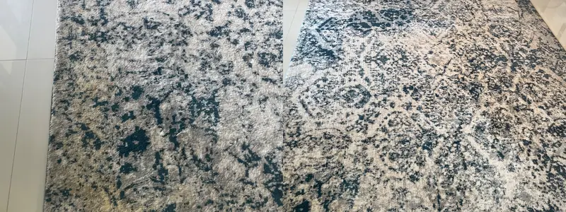 Blue and cream patterned area rug, dingy close view before and brighter full view after